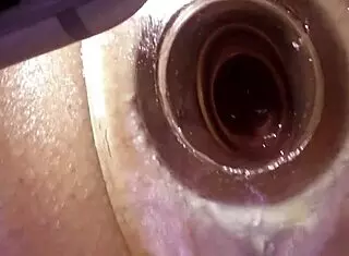She explores her anal tunnel with a vibrator up close