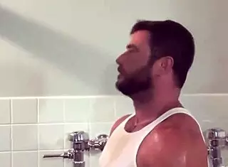 Firefighter hydraulic fucks in the bar's bathroom with a monster cock