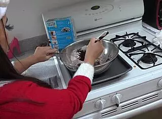 asian milf cooking in skirt upskirt view