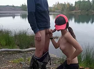 brunette outdoor blowjob by the lake