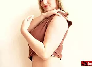 Curvy blonde displays her huge tits for the camera.