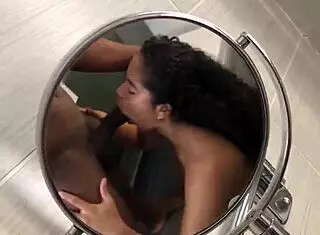 brunette secretly gives her lover a blowjob in public outdoor spot with big black cock