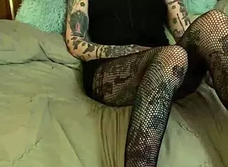 Tattooed girl with glasses encourages intense jerk off session with teasing words