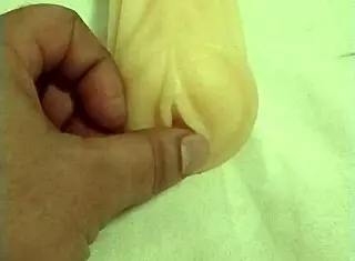 Fuck doll gets artificial pussy fingered hard!