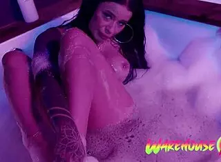 inked babe relaxes with self-pleasure in the bathtub