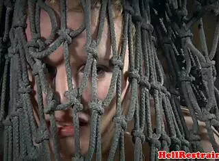 The bound sub feels suspended by her maledom master with dildo spreading