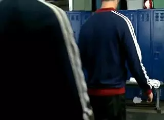 Guy sucking three cocks in locker room