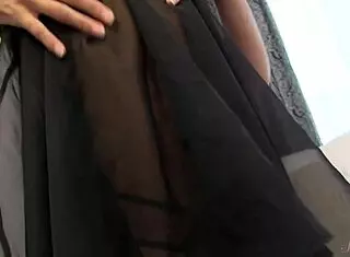 I watch this sexy brunette undress and rub herself