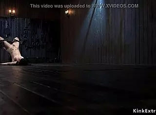 brunette tied up in extreme device for whipping and choking