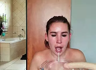 Gathering saliva while fucking throat with double dildo repeatedly