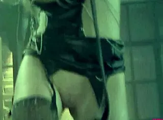 blonde in latex bondage scene