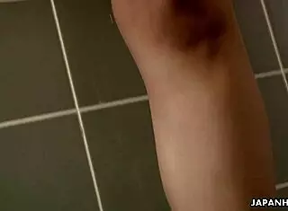 This naked Asian brunette babe rubs herself with long fingers!