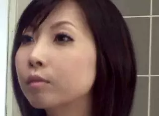 This naked Asian brunette babe rubs herself with long fingers!