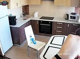 beautiful big tits amateur cleans kitchen topless with pierced nipples