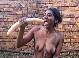 indian slut deepthroats dildo in garden