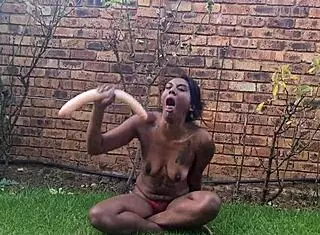 indian slut deepthroats dildo in garden
