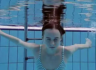 Anna Netrebko, tiny teen, swims underwater in a skimpy bikini at the beach