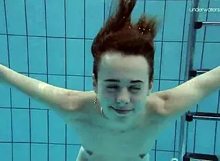 Anna Netrebko, tiny teen, swims underwater in a skimpy bikini at the beach