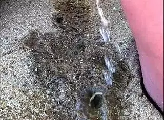 African Wife Pees Long On Beach