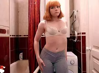 Fitness babe passionately fingers her pussy in the shower solo