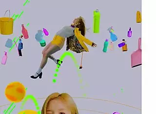 Loona twirls a hula hoop in an energetic performance.