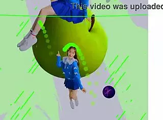 Loona twirls a hula hoop in an energetic performance.