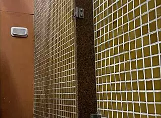 this muscular twink is showering in the gym, and i'm spying on his big cock