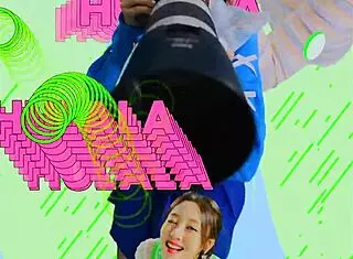 Loona twirls a hula hoop in an energetic performance.