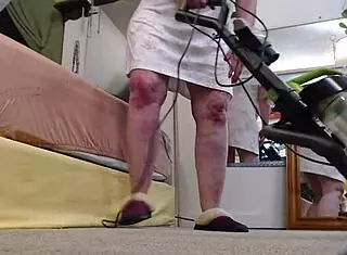 Retro redhead vacuums bare-ass in slippers for wild show