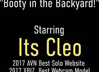 Inked Brunette Cleo Masturbates with Dildo in Garden for Neighbor