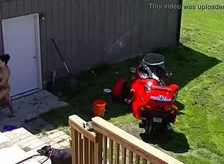 Inked Brunette Cleo Masturbates with Dildo in Garden for Neighbor