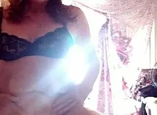 Mature Woman Applies Lotion to Skin