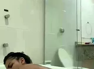 Hot brunette Bia masturbates with lubricating vaginal juices in the bathtub