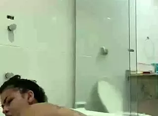 Hot brunette Bia masturbates with lubricating vaginal juices in the bathtub