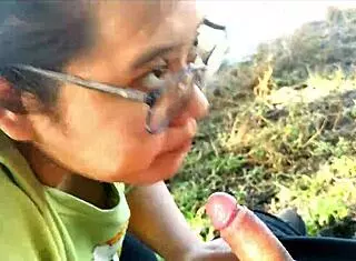 Latina girlfriend gives oral to friend at public lake, leading to orgasm.