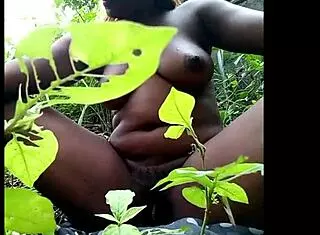 tribal african babe fingering her pussy solo in the woods