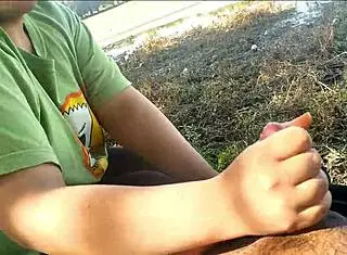 Latina girlfriend gives oral to friend at public lake, leading to orgasm.