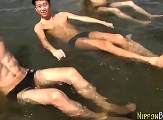 Curious Asian twinks explore wild group action with eager blowjobs. What a steamy interracial encounter!