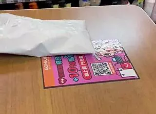 Asian ladyboy displays new thong in stockings at store.