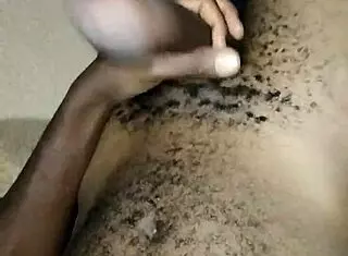 Gay twink wanks his big hairy cock at home