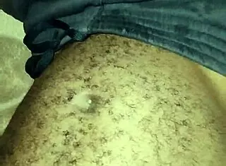 Gay twink wanks his big hairy cock at home