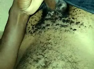 Gay twink wanks his big hairy cock at home