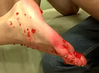 lucky guy enjoys footjob from cute brunette