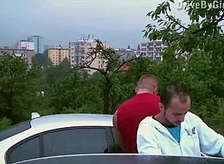 A girl exposes her ass from a car window for a public gangbang orgy.