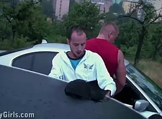 A girl exposes her ass from a car window for a public gangbang orgy.