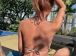 Young Couple Meets and Kisses at Swimming Pool