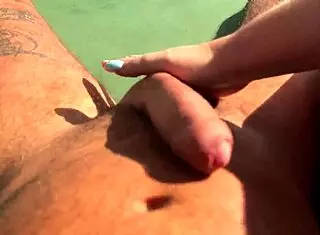 Hot Blonde Babe Gives Fast Handjob On Terrace Over Ocean