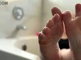 oiled blonde babe displays her feet