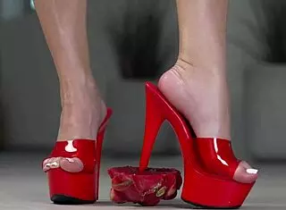 Petite brunette crushes fruits with bare feet and heels in 4k