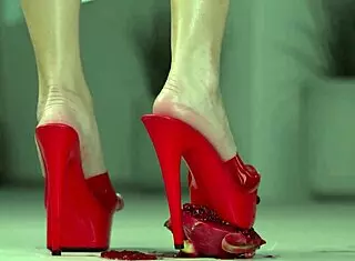 Petite brunette crushes fruits with bare feet and heels in 4k